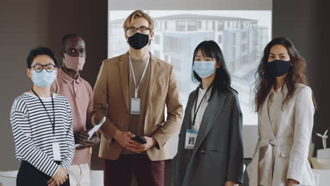 Portrait-of-Business-Team-in-Masks-on-Conference
